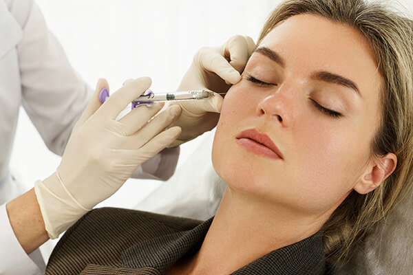 Woman undergoing dermal fillers treatment at Bare Medical Spa and Laser Center